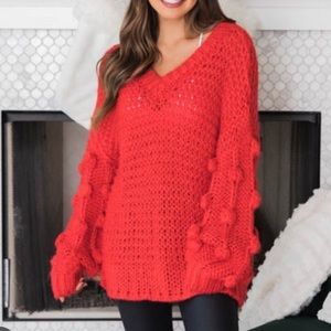 Oversized chunky knit pom sleeve sweater